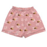 These are cartoon pajama shorts in a pink color with repeating pet faces on them[PajamaShorts]