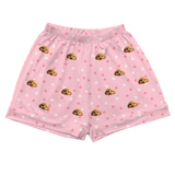 These are cartoon pajama shorts in a pink color with repeating pet faces on them[PajamaShorts]