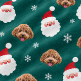 Close-up of the Santa print showing custom pet faces next to Santa Claus faces and snowflakes on a green fabric