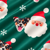 Close-up of the Santa print showing custom pet faces next to Santa Claus faces and snowflakes on a green fabric
