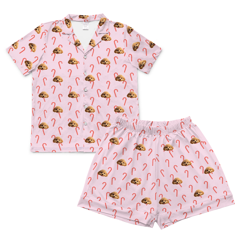 Pink pajama set with candy cane and mushroom pattern on a white background