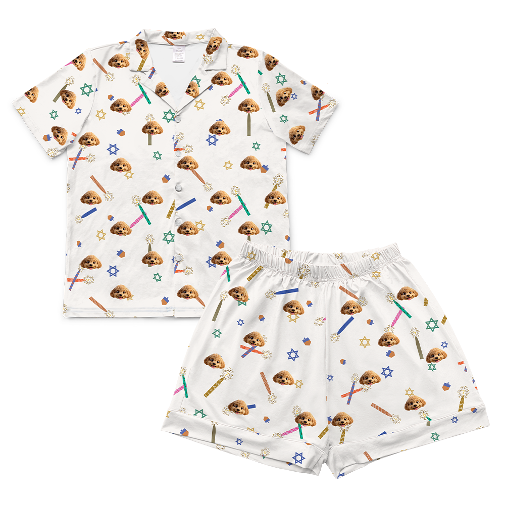 Children's pajama set with cartoon character pattern on a white background