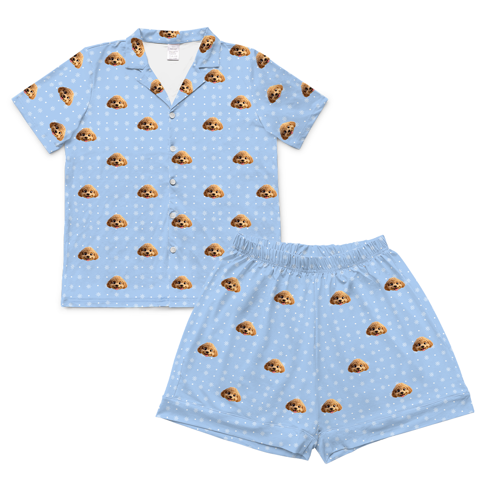 Light blue pajama set with brown dog print on a white background