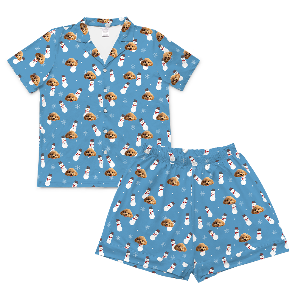 Blue pajama set with dog and snowman pattern on a white background