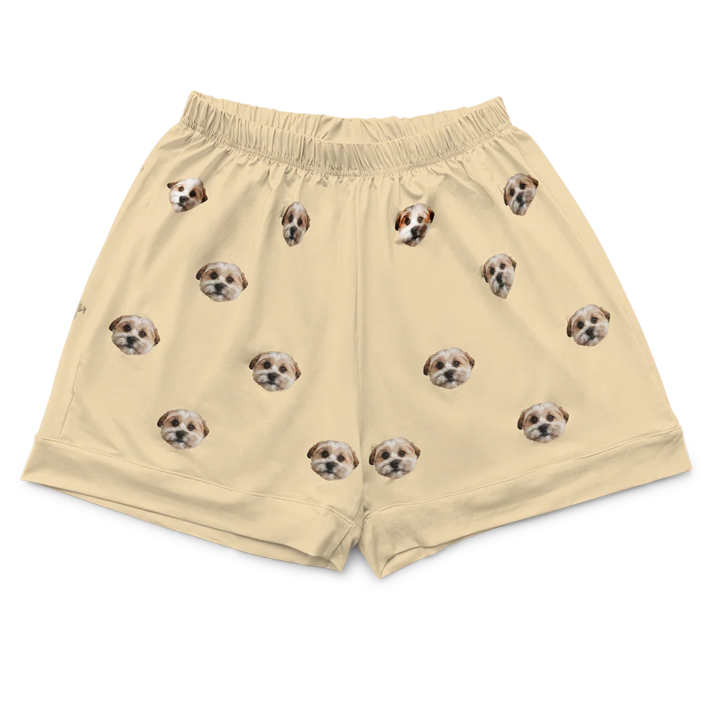 These are pajama shorts in a yellow color with repeating pet faces on them[PajamaShorts]