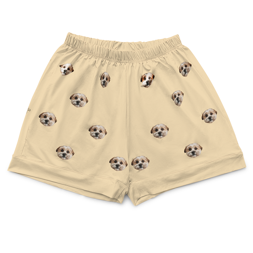 These are pajama shorts in a butter yellow color with repeating pet faces on them[ButterYellowPajamaShorts($45.00)]