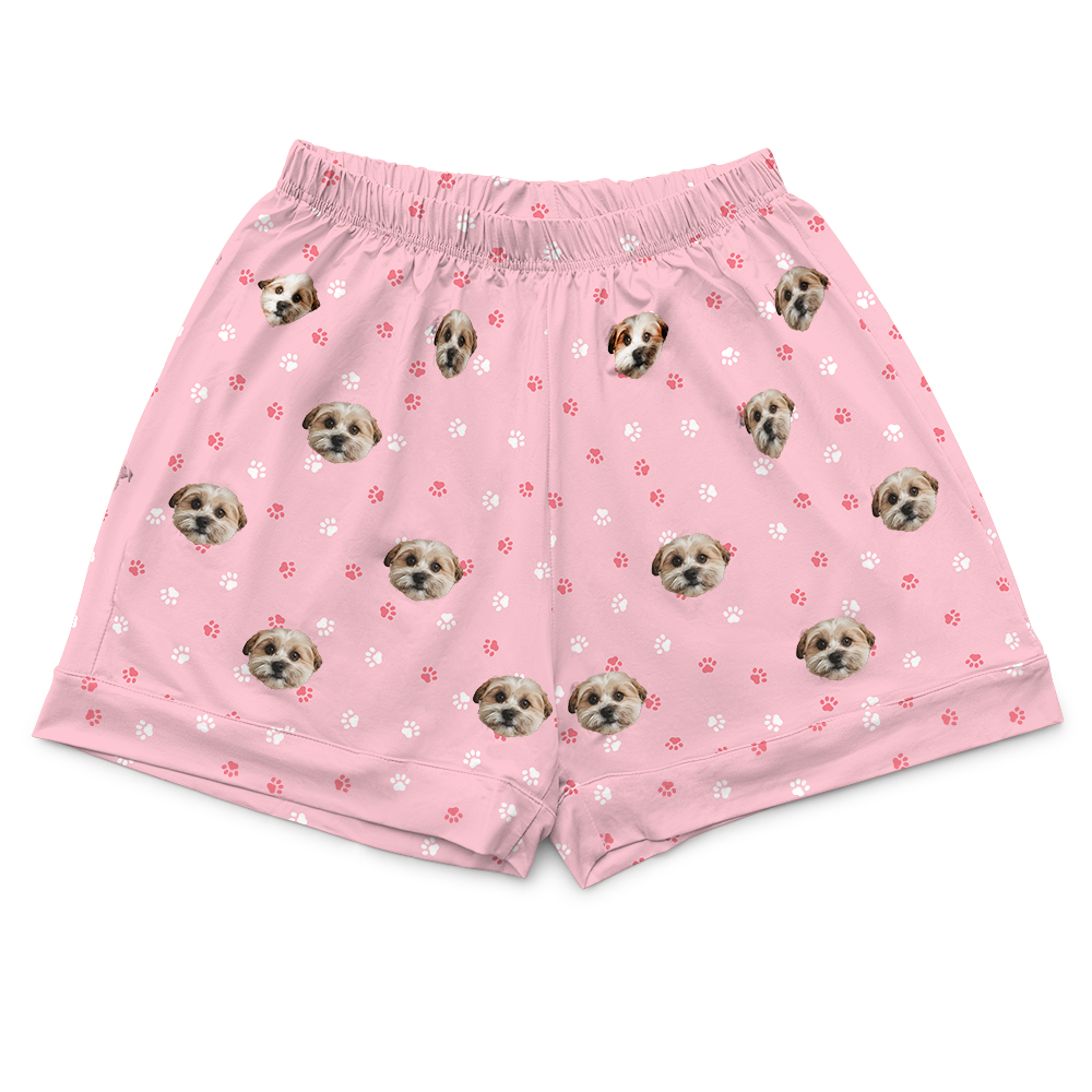 These are pajama shorts in a pink color with repeating pet faces on them[PajamaShorts($45.00)]
