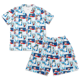 A two-piece pajama set featuring a short-sleeve button-front top and matching shorts, both printed with a repeating pattern of Dalmatian dogs in blue and white panels.