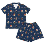 A two-piece short-sleeve pajama set consisting of a button-front collared shirt and matching shorts, both in a deep burgundy red fabric with an all-over print of dog faces inside circular frames.
