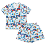 A two-piece pajama set featuring a short-sleeve button-front shirt and matching shorts, both printed with a repeating collage pattern of cartoon polar bears in winter outfits on a light blue background.