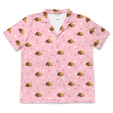 These are cartoon pajama shirt in a pink color with repeating pet faces on them[ShortSleevePajamaShirt]