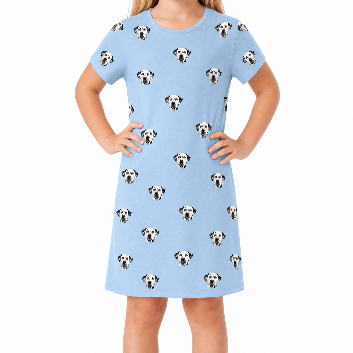 Sky blue nightgown with Dalmatian pattern worn by a child on a white background