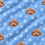 Close-up of the Snowflakes print showing custom pet faces among white snowflakes on a light blue fabric