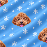Close-up of the Snowflakes print showing custom pet faces among white snowflakes on a light blue fabric