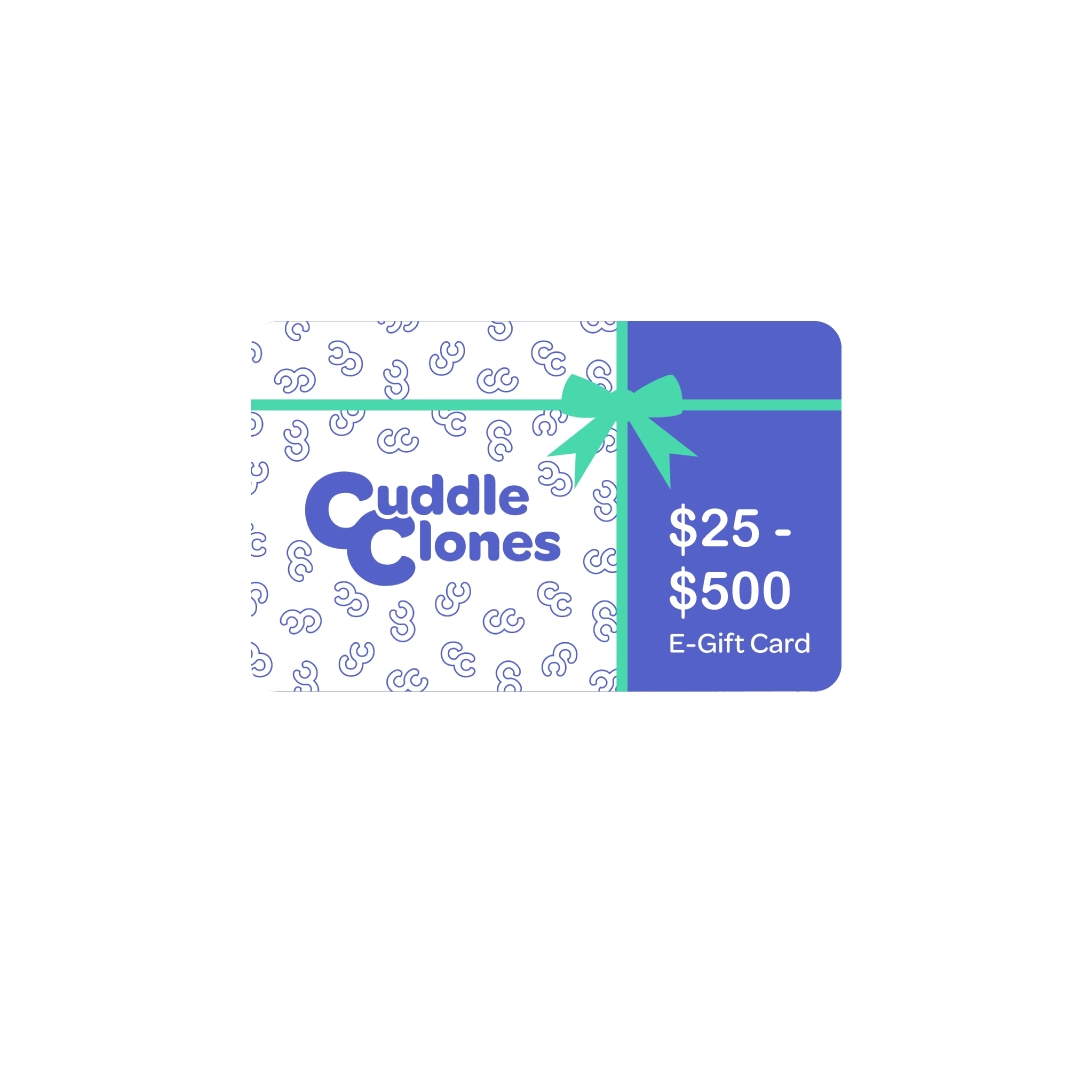 Cuddle Clones gift card: $25-$500. Perfect for custom pet gifts. E-gift card with a green bow on a blue patterned background.
