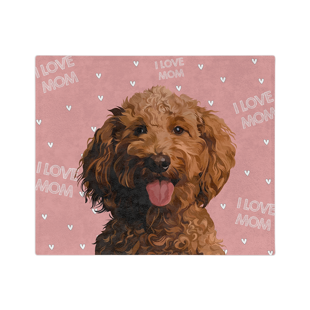 Pink blanket with hearts and the phrase "I Love Mom" featuring a centered, smiling dog illustration.