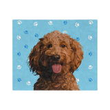 Blue blanket with paws, featuring a centered, smiling dog illustration.