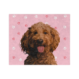 Pink paw print blanket featuring a centered, smiling dog illustration.