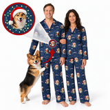 A man and a woman wearing matching navy blue pajamas with a festive Christmas dog print, standing barefoot on a white background. A corgi is pictured beside them, and a circular inset shows a close-up of the printed design on the pajama sleeve.