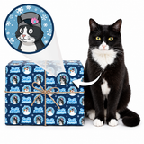 A black-and-white cat sits beside a wrapped gift box on a white background. The gift box is wrapped in blue holiday paper with a repeating print of the cat wearing a winter hat, and a white arrow points from the cat to the box, suggesting the cat is the design source.