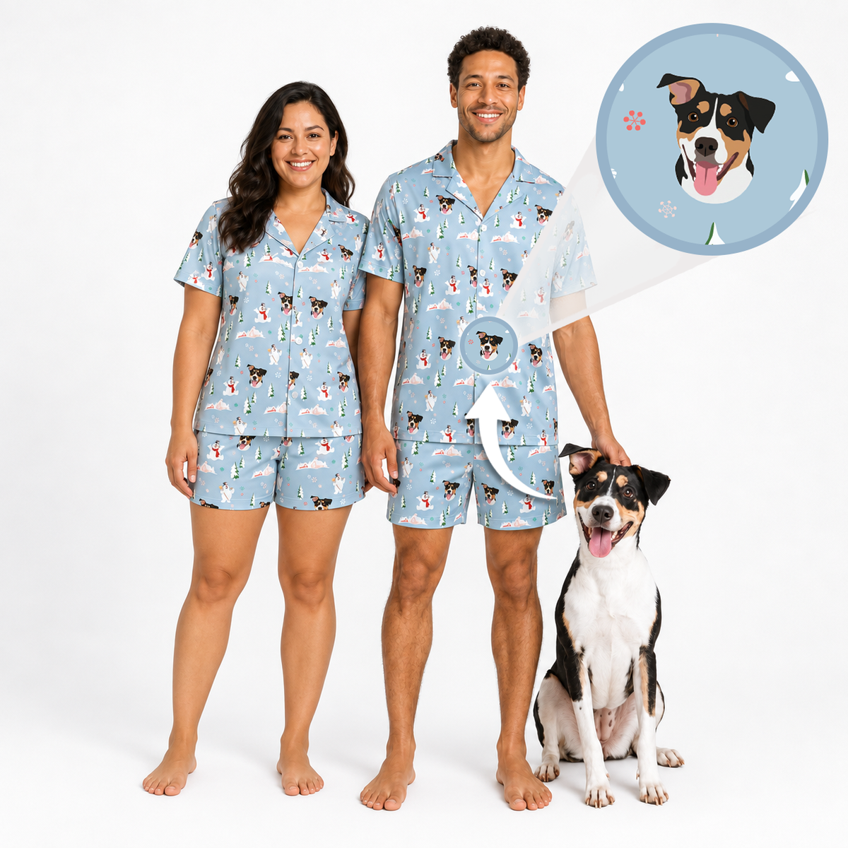 A man and a woman wearing matching light blue pajama sets with a dog print, standing barefoot on a white studio background next to a black and white dog. A circular inset shows a dog portrait that appears inside the pajama print.
