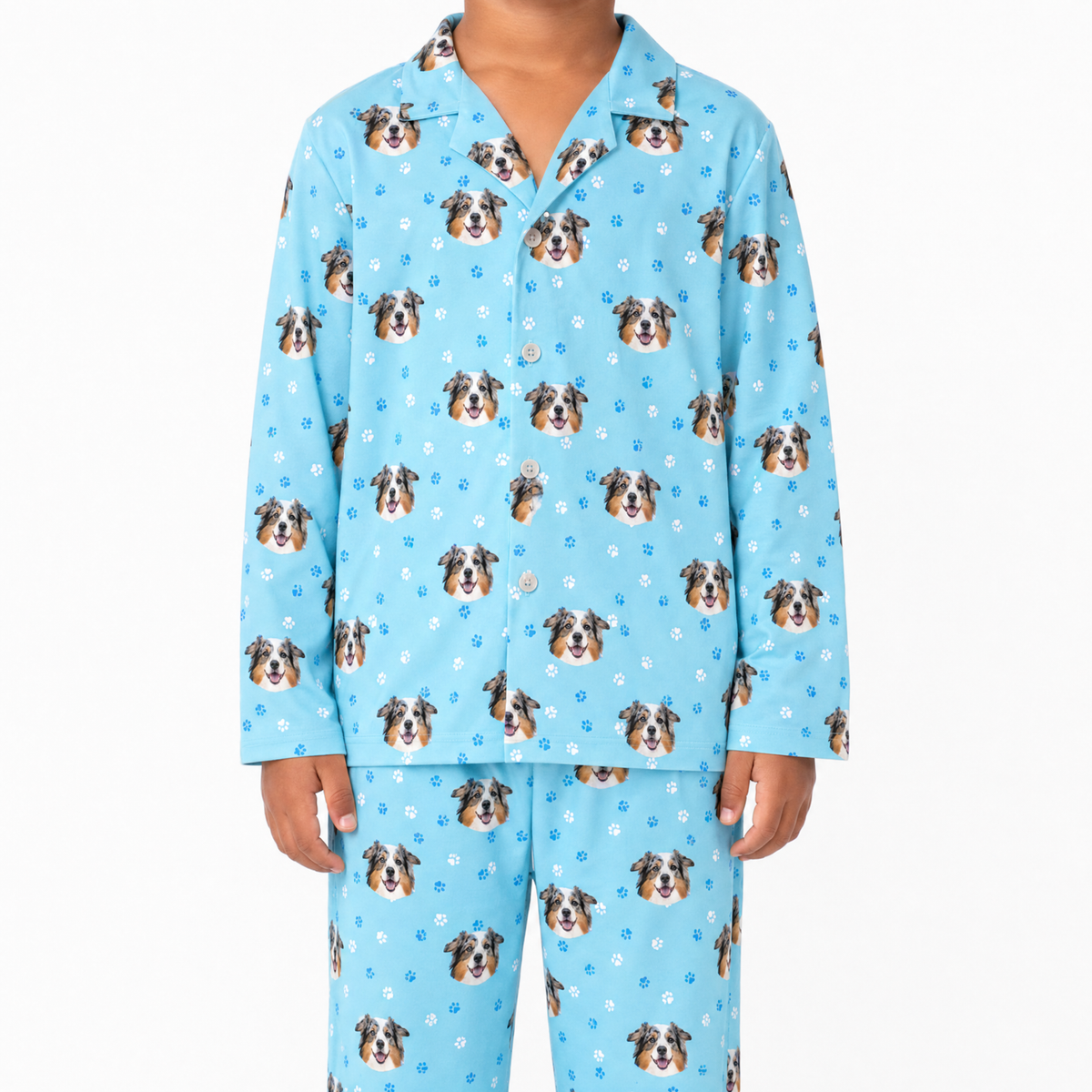 Kids light blue pajama set with dog pattern on a white background