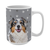 Close up of gray ceramic mug with paws pattern, featuring a smiling, multicolored Australian Shepherd [SlateGrayPawsHandIllustration]