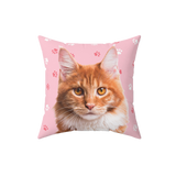 Pink pillow with paws, it features a portrait of a cat. [LightPinkPawsImageCutOut]