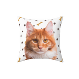 White pillow with paws and bones, it features a portrait of a cat. [PawsandBonesImageCutOut]