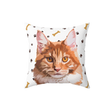 White pillow with paws and bones, it features an illustration of a cat. [PawsandBonesHandIllustration]