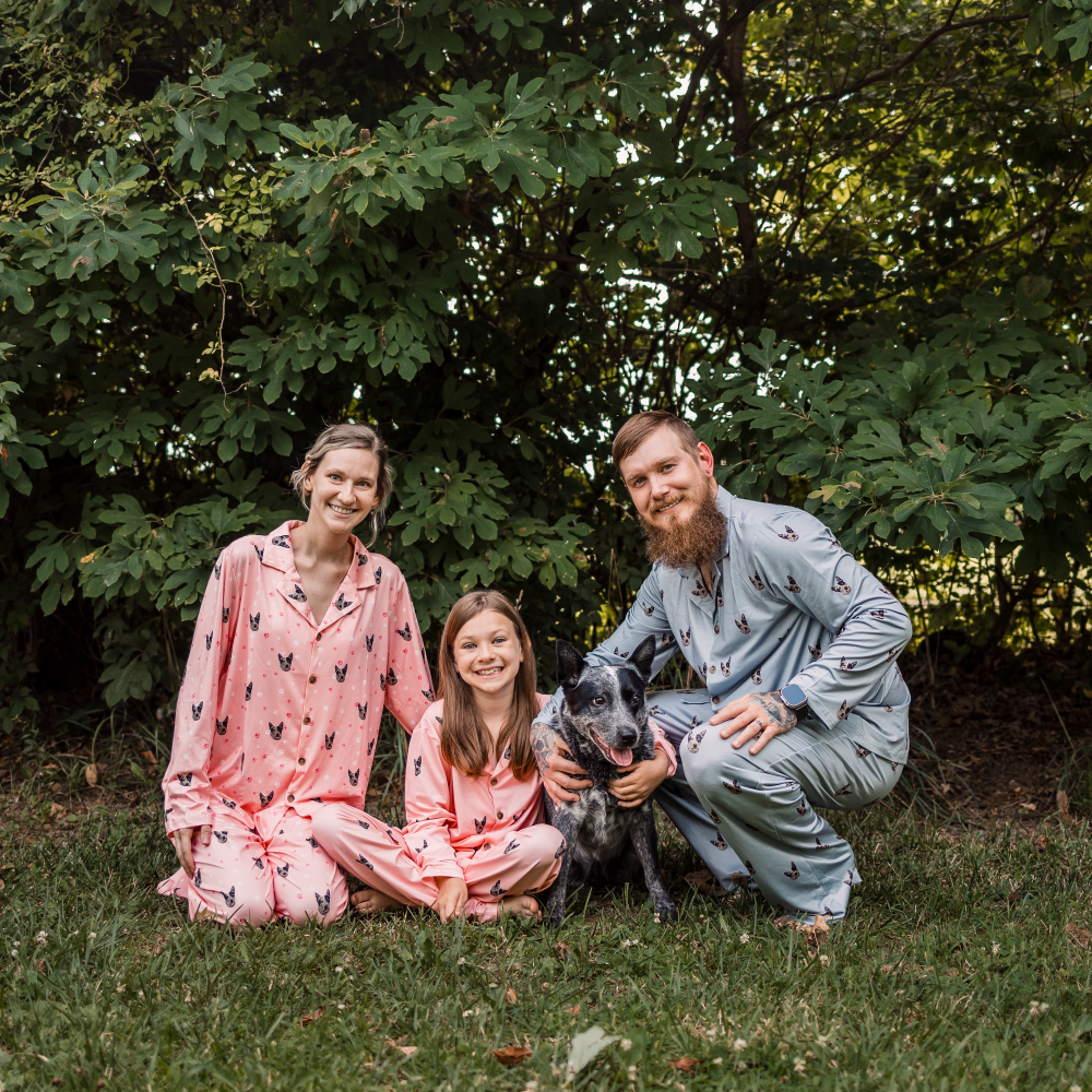 Family wearing with Light Pink Paws pajama with their cute dog