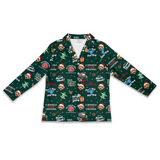 A long-sleeve V-neck pajama shirt with a dark green Christmas-themed print featuring cartoon dog characters in Santa hats, holiday text, and festive illustrations, shown flat against a white background.